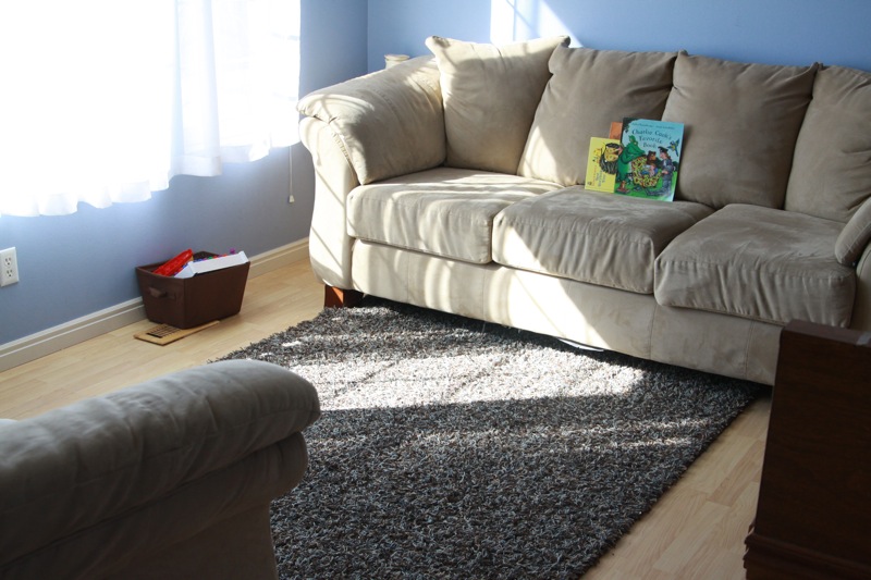 A living room with large window on one side