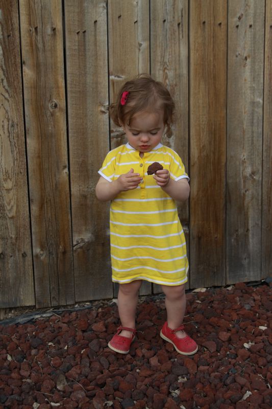 baby girl wearing a yellow dress