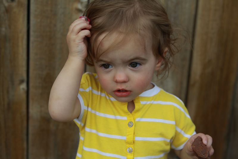 A little girl in a yellow dress