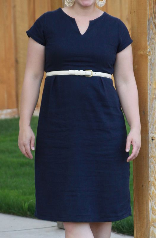A woman wearing a refashioned navy dress
