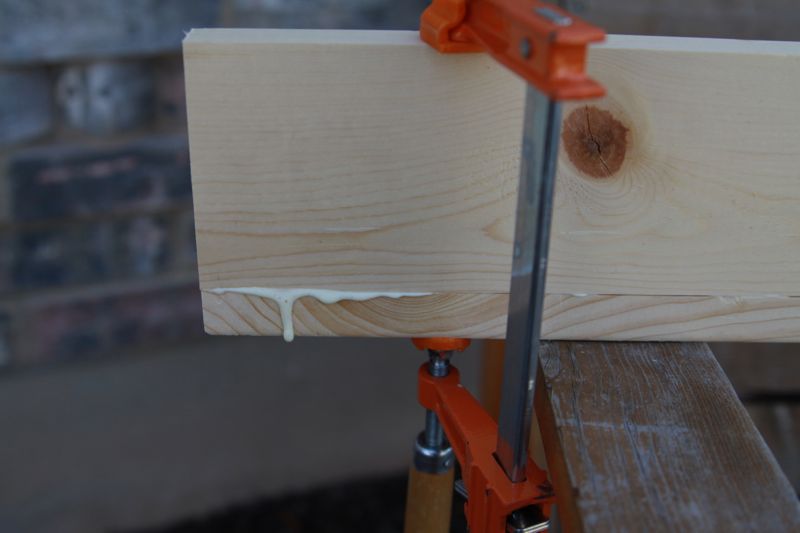 two pieces of wood clamped together