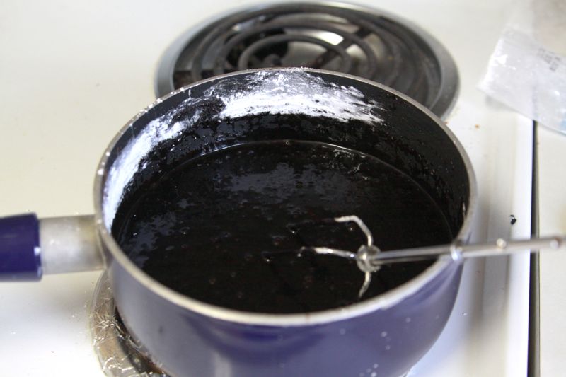 dark chocolate frosting in a saucepan on the stove