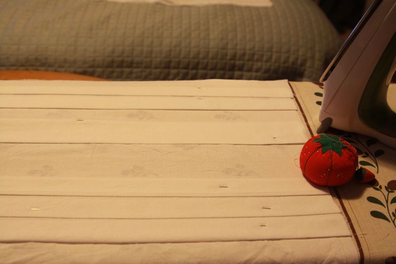 Pleats ironed into white fabric
