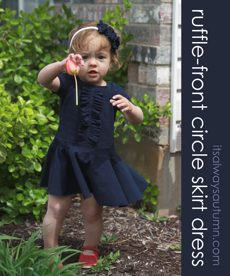 baby girl wearing ruffle front dress