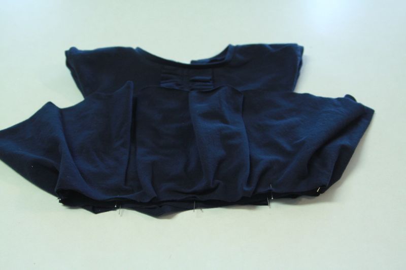 skirt placed over top and pinned together at waistline