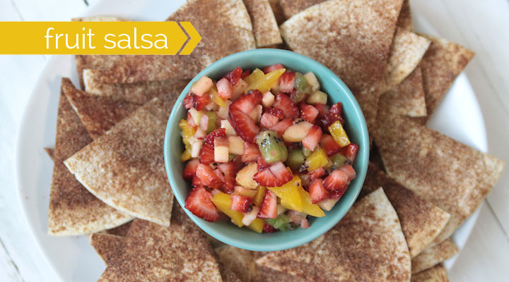 fruit salsa in a bowl surrounded by cinnamon sugar tortilla chips