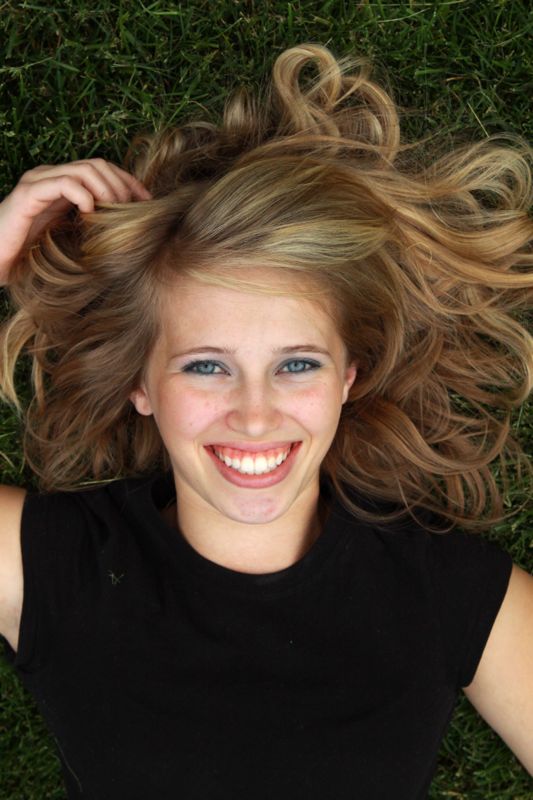 A girl lying on the grass, photo taken from straight above