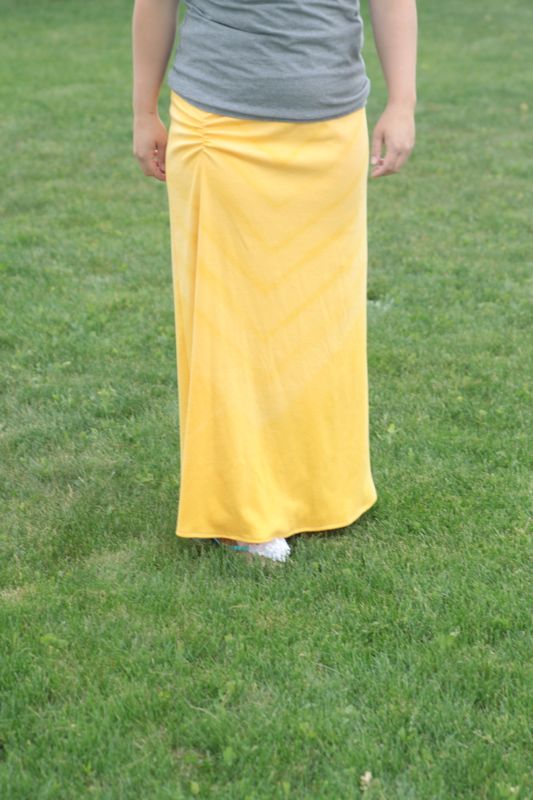 woman wearing yellow maxi skirt