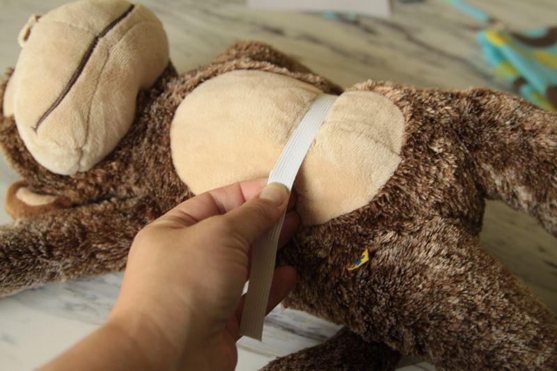 Measure elastic around stuffed animal
