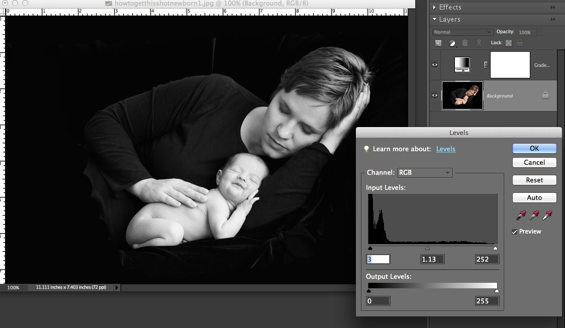 black and white photo of mom and baby open in photoshop elements with levels box open