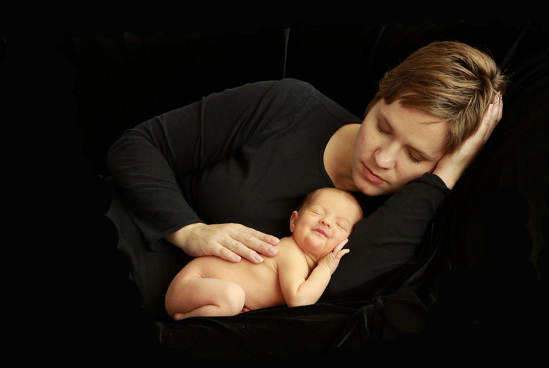 photo of mom and baby with black background