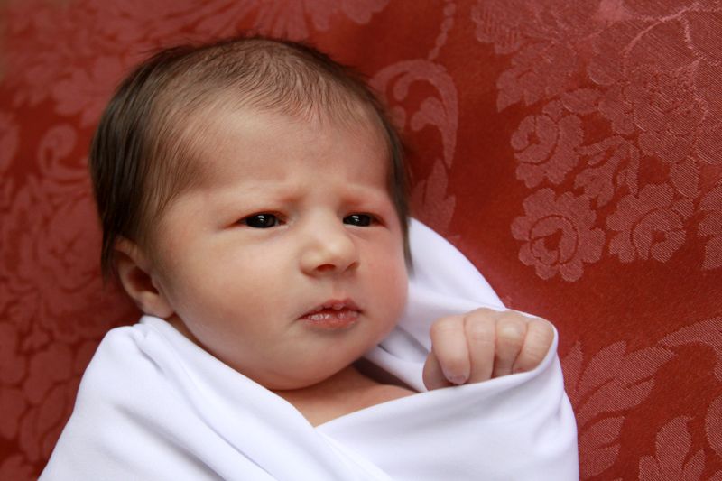 A close up photo of a newborn baby