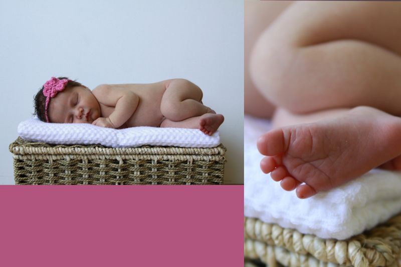 A baby lying on top of a wicker basket, closeup of baby\'s feet