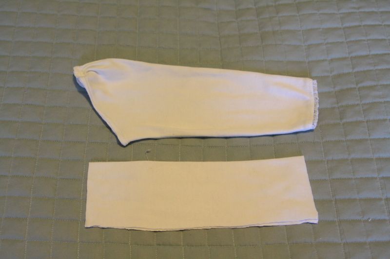 sleeve of shirt and rectangle pieces of white fabric