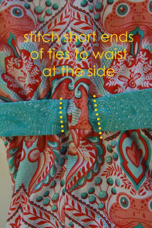 Short ends of ties stitched to romper at side waist