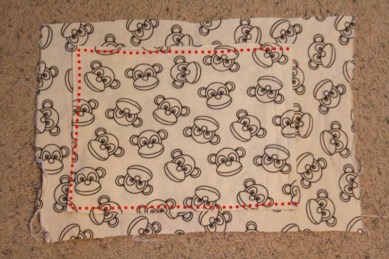 Pocket on front piece of fabric pillow case, dots marking seams to sew it on