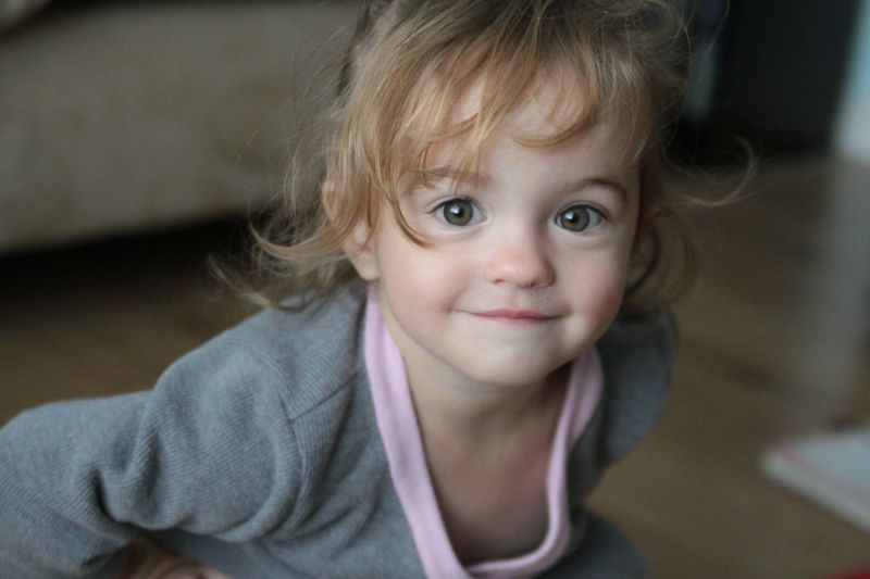 A little girl smiling at the camera