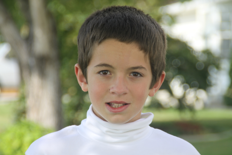 A Photo of a boy at 135mm focal length up of a boy