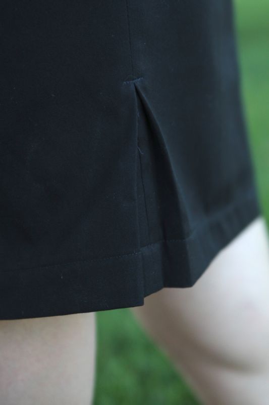 Kick pleat on a black skirt