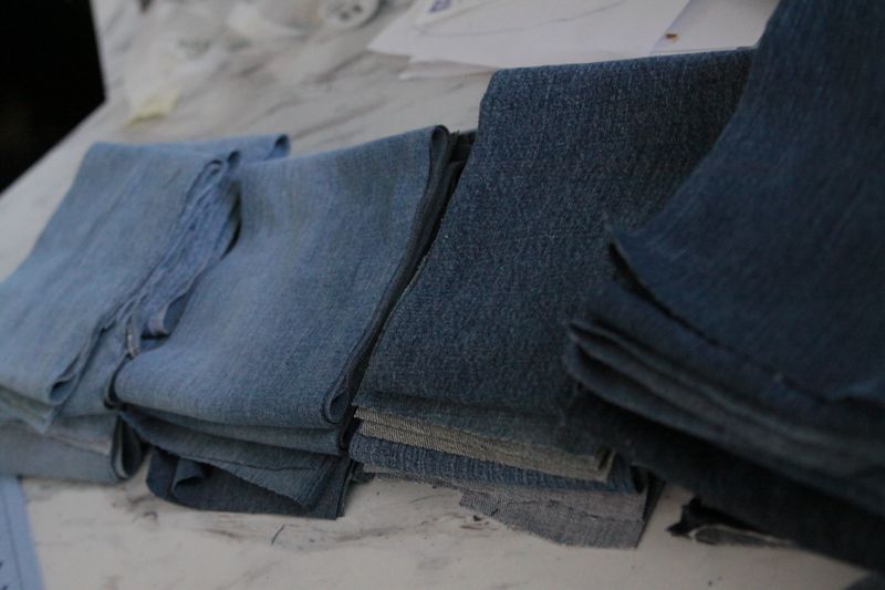 Stack of rectangles from jeans fabric, sorted by color