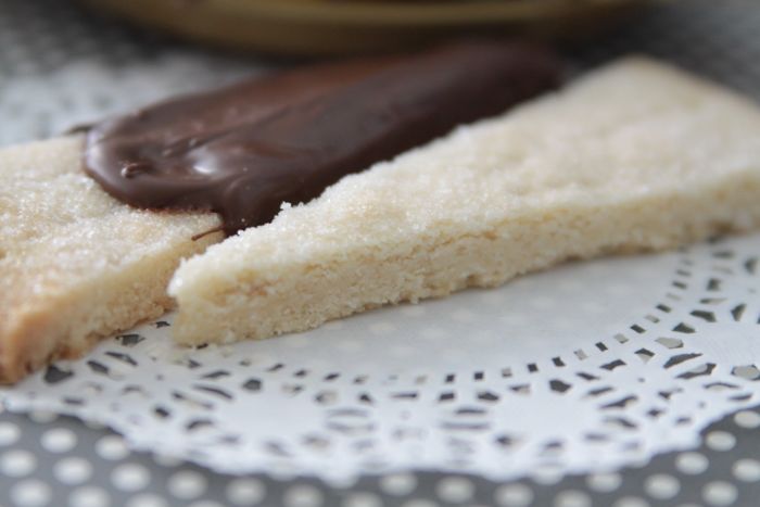 A close up of a wedge slice of shortbread