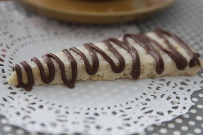 A piece of shortbread with chocolate drizzle