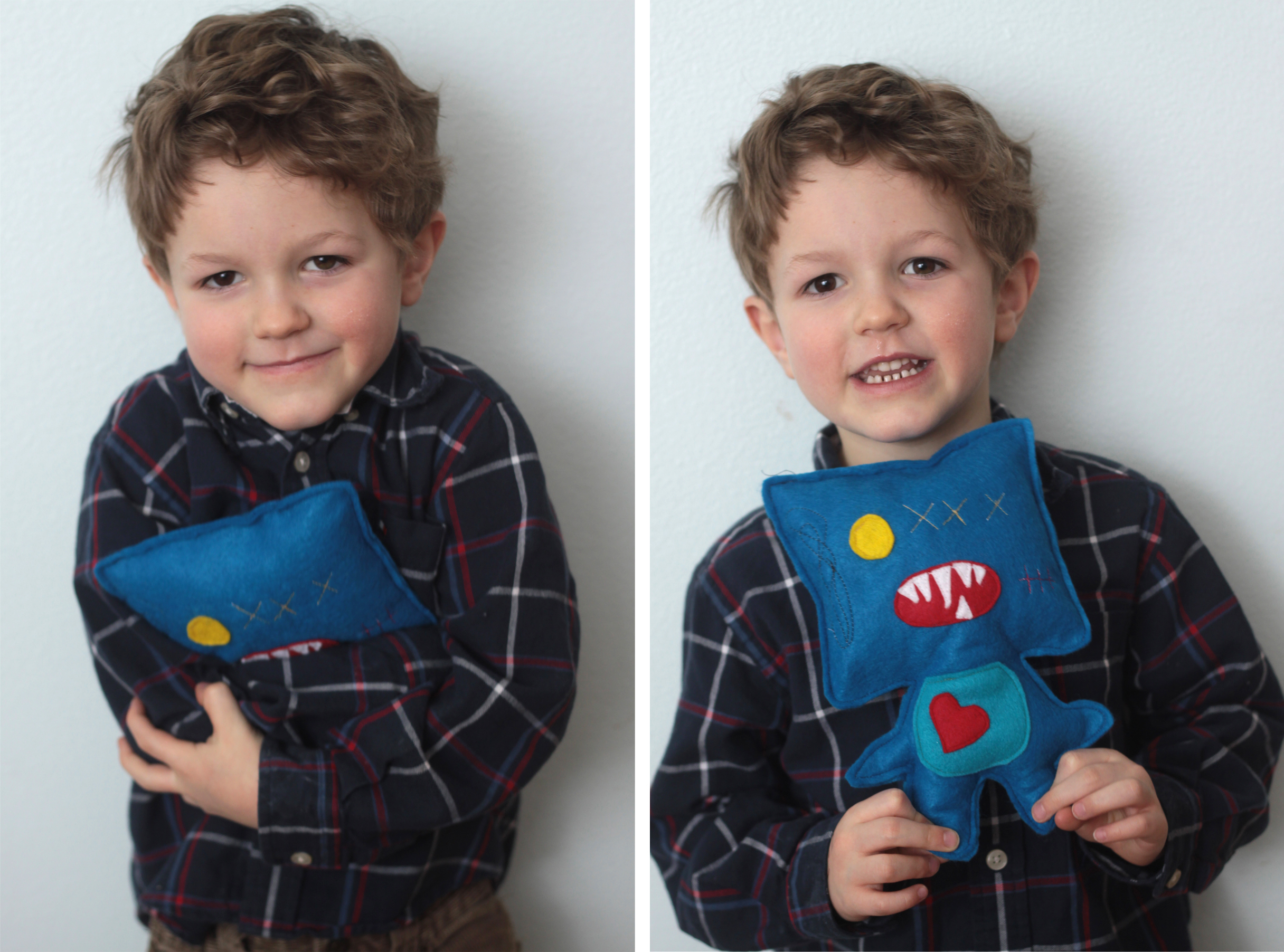 A little boy holding a felt monster he made