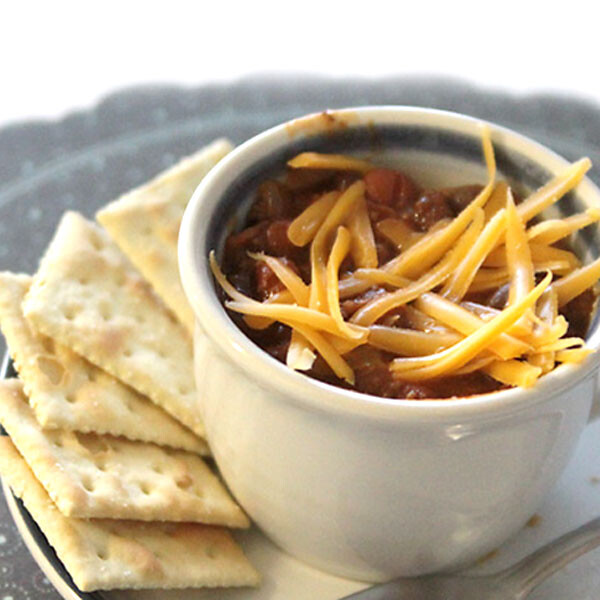 A bowl of chili with cheese