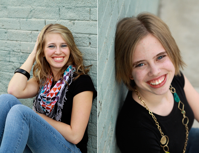 girls leaning against pretty brick wall
