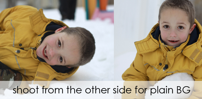 photo of boy playing in snow with distractions in the background; photo taken from different angle so there\'s only snow in the background