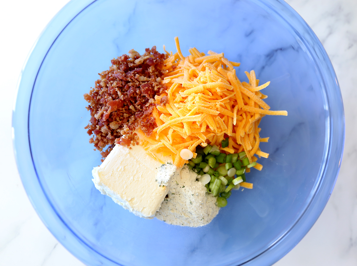 Cheese ball ingredients: cream cheese, cheddar, green onions, bacon bits, ranch dressing mix, almonds