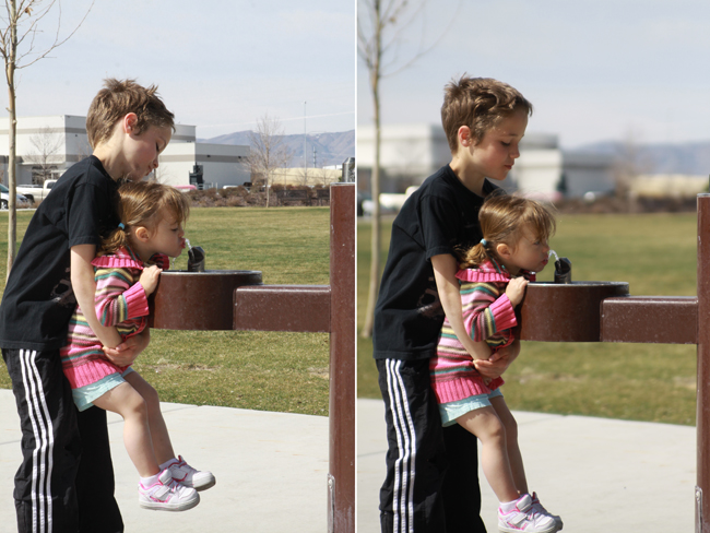 photo of a boy and girl at a drinking fountain the; same photo with blurry background