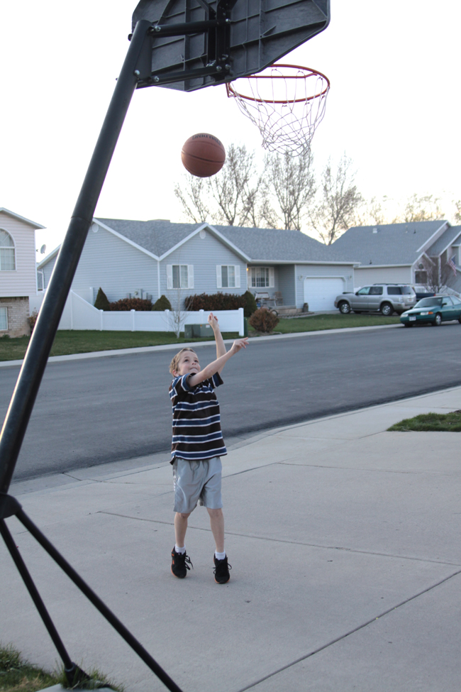 A boy shooting a basket