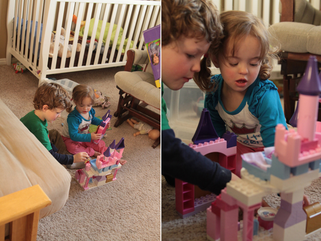 Little kids playing with toys; close up of brother and sister playing with legos