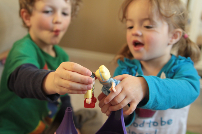 A little boy and girl playing with toys