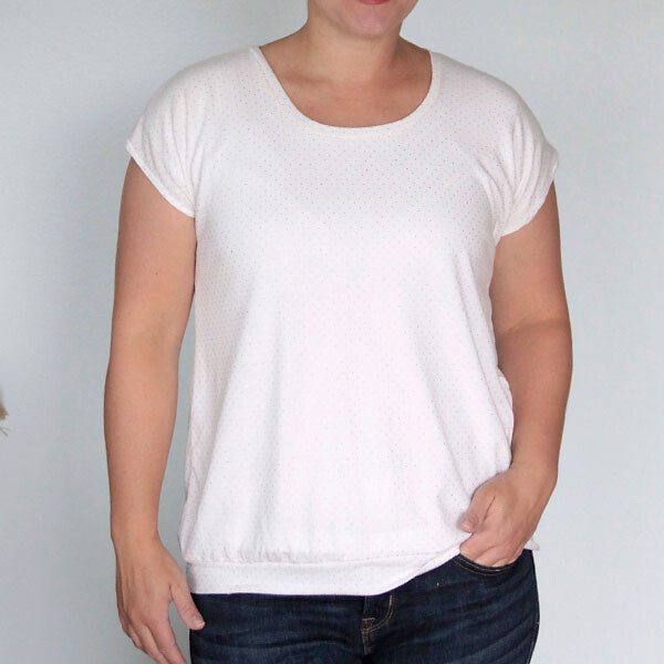 A person standing posing for the camera, wearing the EASY TEE pattern