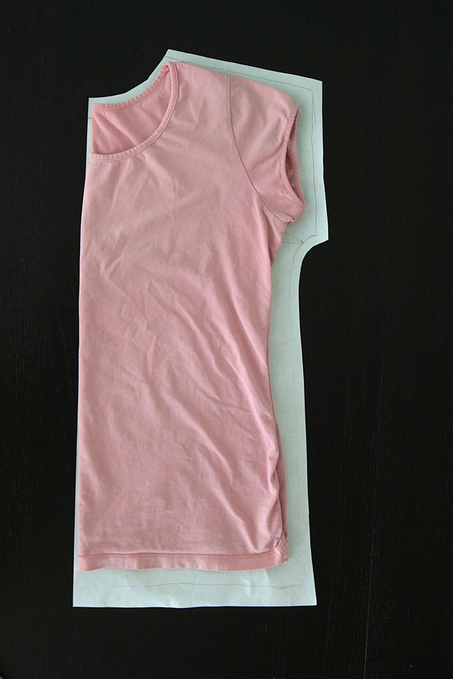 A pink shirt traced around to create a pattern