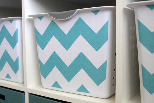 A close up of a storage bin that\'s been covered with fabric