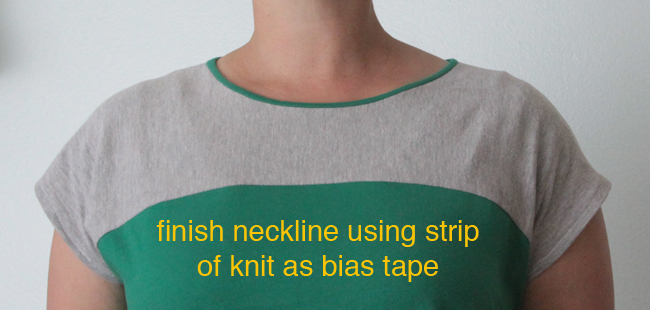 Neckline finished using strip of green knit as bias tape