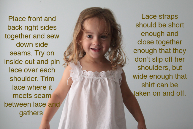 A little girl in a white lace blouse, fitting lace straps over the shoulders
