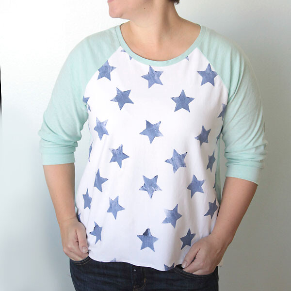 A woman in a raglan t-shirt with stars stamped on it