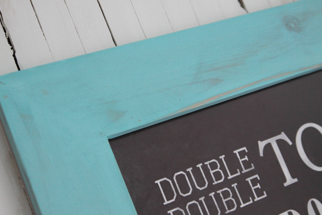 closeup of wood frame painted turquoise