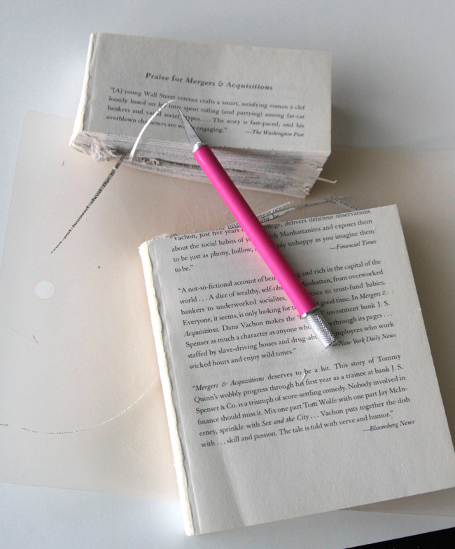 book that has the top 1/3 cut off and exacto knife