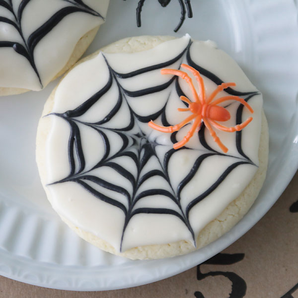 Sugar cookies decorated to look like a spiderweb