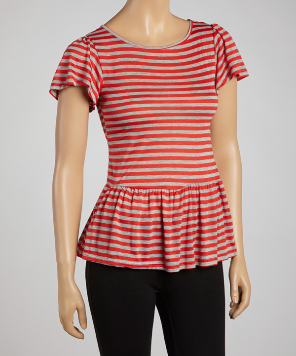 A person wearing a red striped peplum top