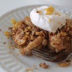 healthy apple crisp on a plate with whipped topping