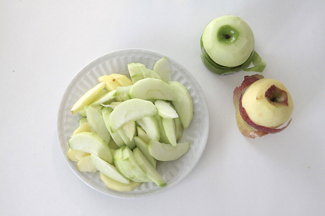 Apples peeled and sliced on a plate