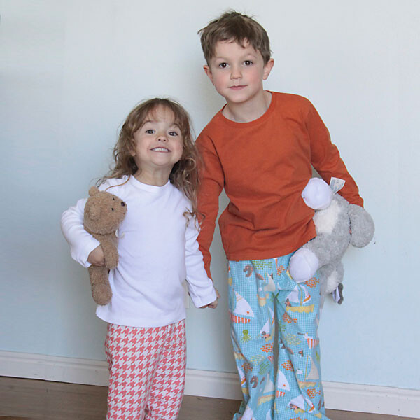 A little girl and girl wearing homemade pajamas