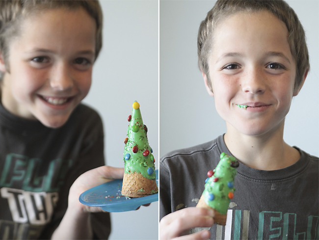 A young boy eating a Christmas tree ice cream cone