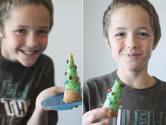 A young boy eating a Christmas tree ice cream cone